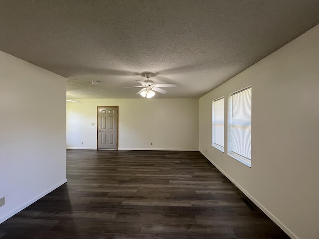328 E 4th St, Willow Springs, MO 65793 - spare room with ceiling fan, visible vents, baseboards, a textured ceiling, and dark wood-style flooring