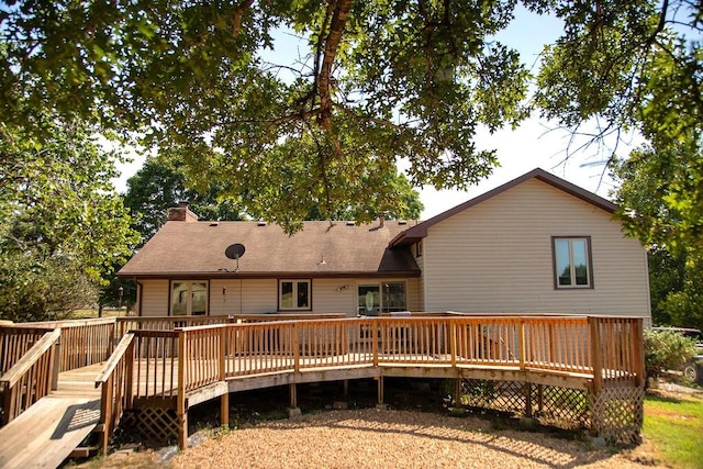 rear view of house with a wooden deck