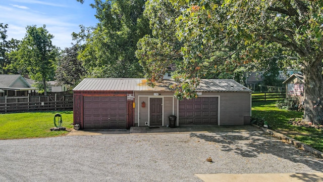 garage featuring a yard