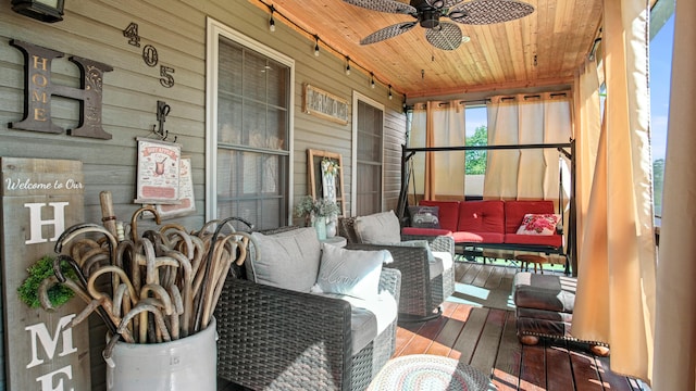 sunroom / solarium with wooden ceiling and ceiling fan