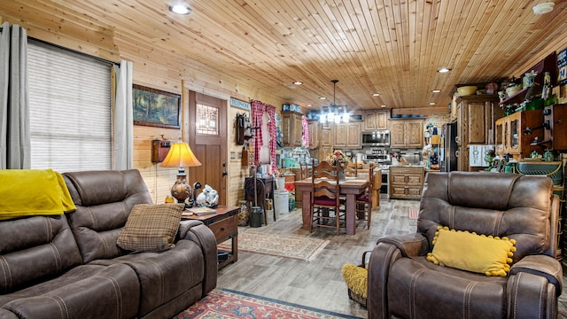 living room with wood ceiling, light hardwood / wood-style flooring, and wooden walls