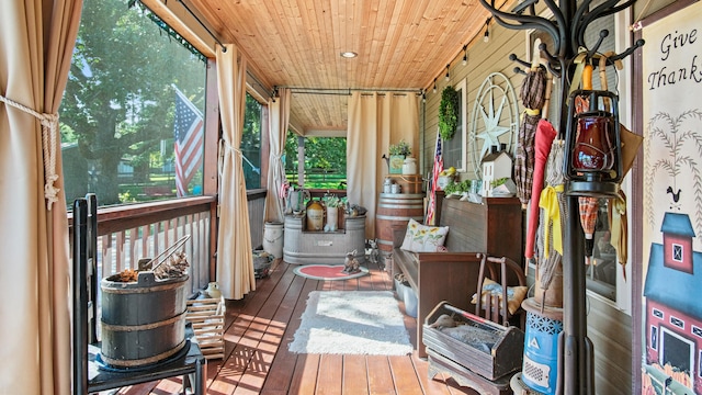 sunroom featuring wooden ceiling