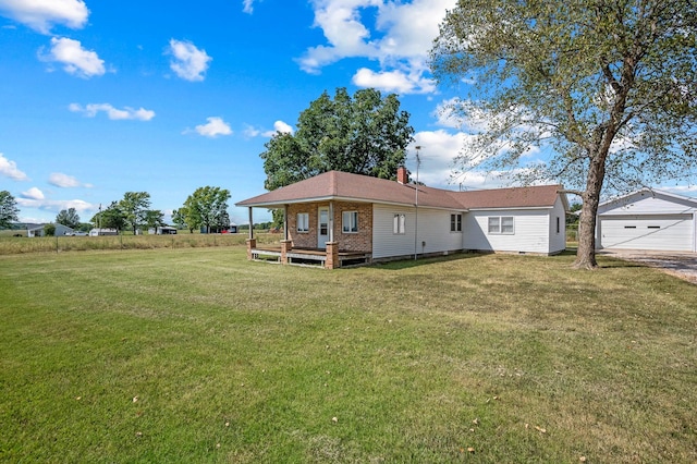 rear view of property featuring a lawn