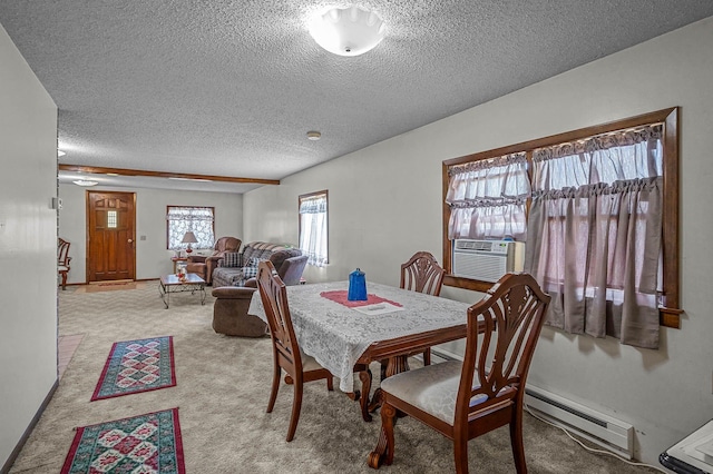 dining room featuring light colored carpet, a baseboard radiator, and a textured ceiling