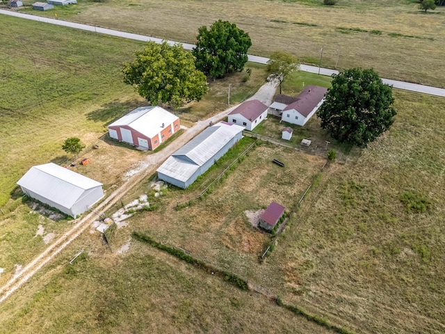 birds eye view of property featuring a rural view