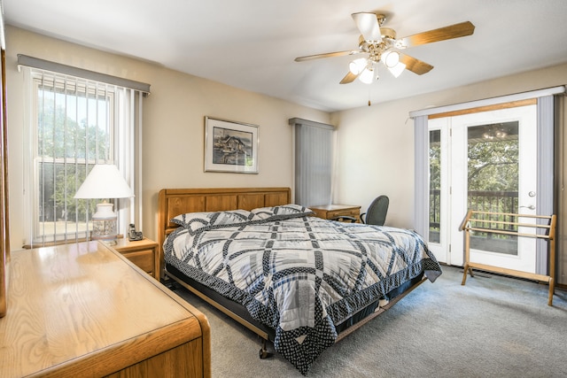 carpeted bedroom featuring access to exterior, multiple windows, and ceiling fan