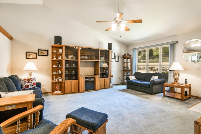 carpeted living room featuring ceiling fan and high vaulted ceiling