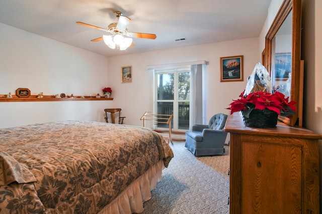 bedroom featuring ceiling fan and light colored carpet