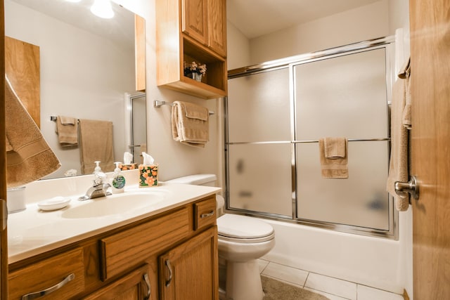 15 Bay Front Ln Apt A, Kimberling City, MO 65686 - bathroom with vanity, toilet, enclosed tub / shower combo, and tile patterned floors