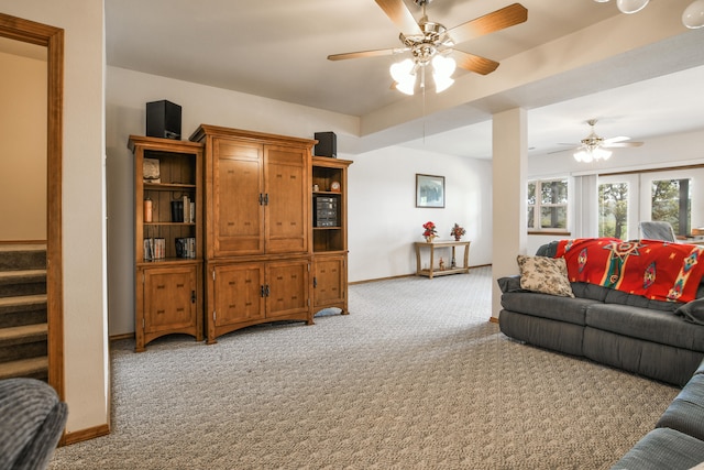 carpeted living room featuring ceiling fan