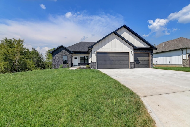 view of front of home featuring a garage and a front lawn