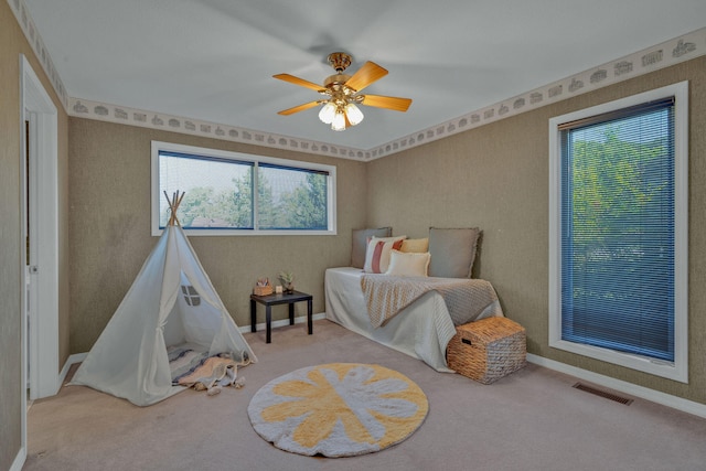 carpeted bedroom with ceiling fan