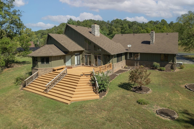 rear view of property featuring a yard