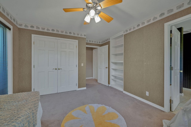 bedroom featuring light colored carpet and ceiling fan