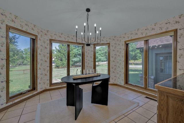 unfurnished dining area featuring light tile patterned floors and an inviting chandelier