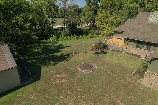 view of yard with an outdoor fire pit