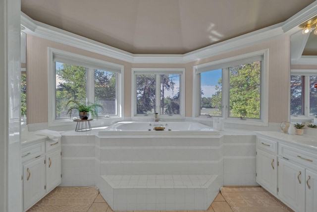 bathroom with tile patterned floors, vanity, and tiled tub