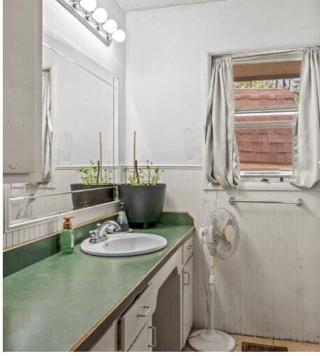 bathroom featuring vanity and visible vents