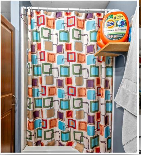 full bathroom with a shower with shower curtain