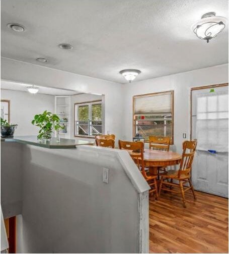 dining room with light wood-style flooring