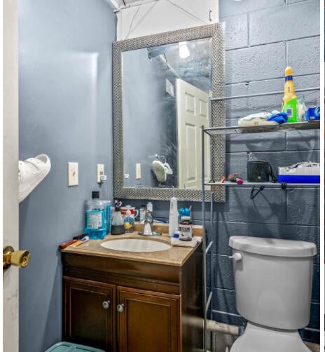 bathroom featuring vanity and toilet