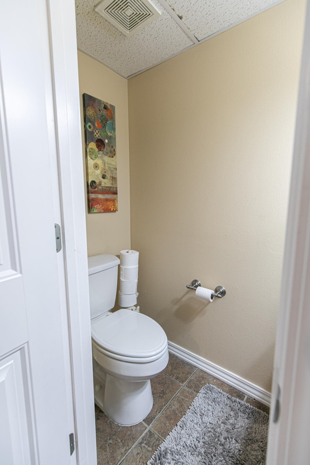 bathroom featuring toilet and tile patterned floors