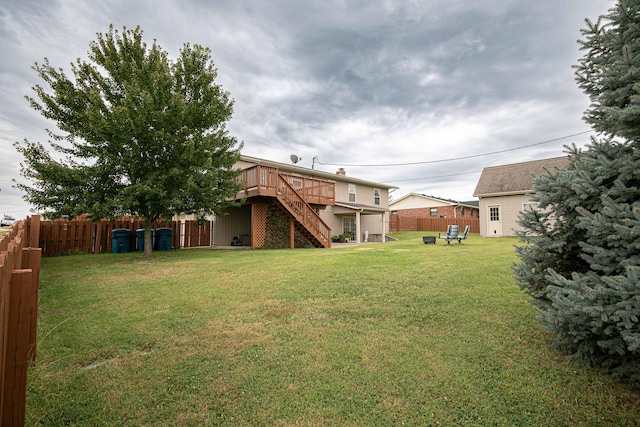 view of yard with a wooden deck