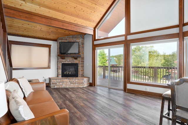 living room featuring a fireplace, vaulted ceiling with beams, hardwood / wood-style floors, and wooden ceiling