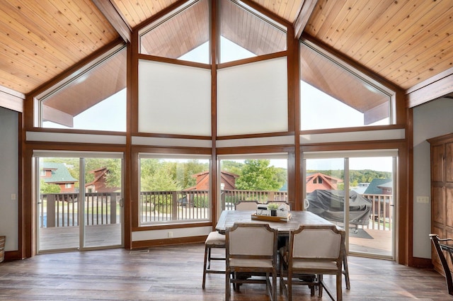 dining area featuring wood ceiling, hardwood / wood-style floors, and high vaulted ceiling