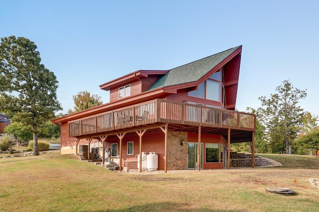 back of property featuring a yard and a deck