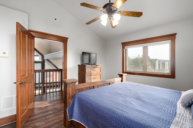 bedroom with ceiling fan, lofted ceiling, and dark hardwood / wood-style floors