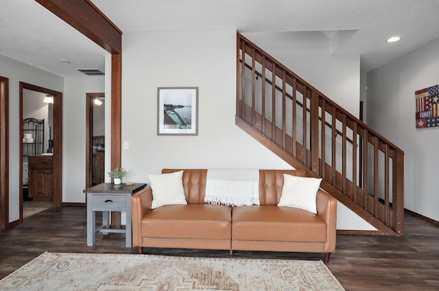 living room featuring dark wood-type flooring