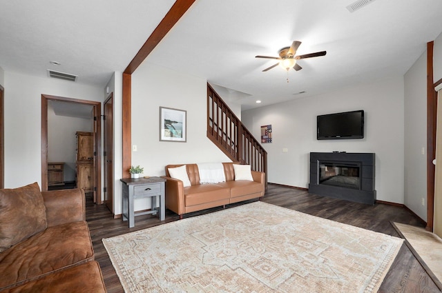 41 Western Red Cedar St, Branson, MO 65616 - living room with a glass covered fireplace, wood finished floors, visible vents, and ceiling fan