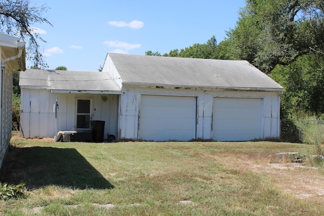 garage with a lawn