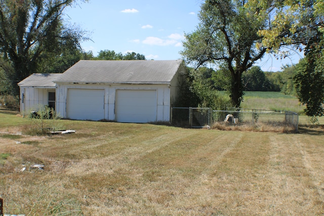 garage with a yard