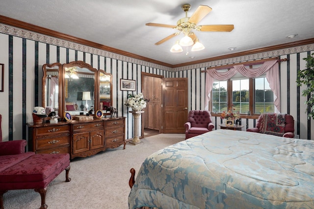 bedroom with ceiling fan, a textured ceiling, crown molding, and light carpet