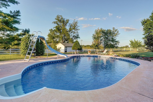 view of swimming pool featuring a water slide