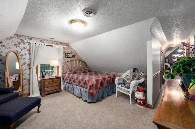 carpeted bedroom featuring vaulted ceiling and a textured ceiling