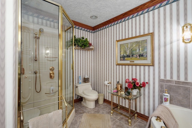 bathroom with separate shower and tub, toilet, a textured ceiling, and tile patterned floors