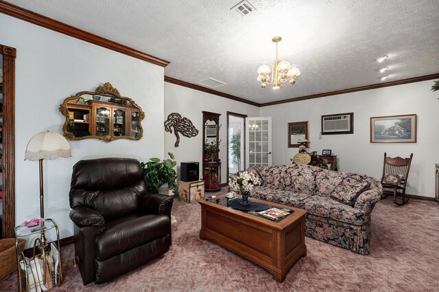 living room featuring carpet floors, a notable chandelier, ornamental molding, a wall mounted air conditioner, and a textured ceiling