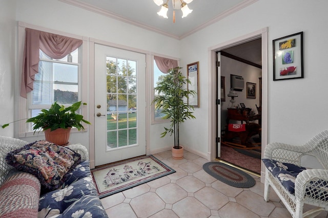 entryway featuring an inviting chandelier, ornamental molding, and a wealth of natural light