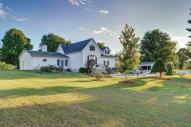 back of house featuring a yard