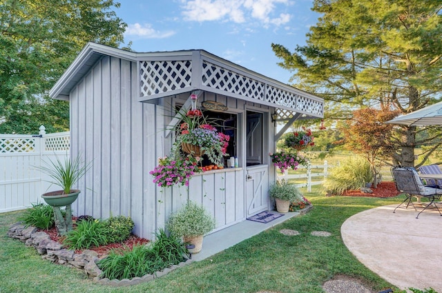 view of outbuilding with a lawn