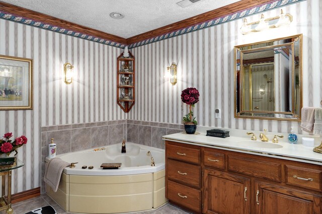 bathroom with tile patterned floors, vanity, plus walk in shower, and a textured ceiling