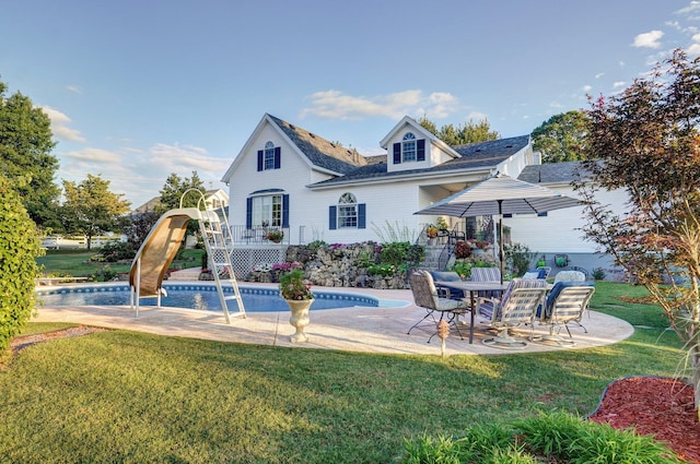 1568 Glossip Ave, Highlandville, MO 65669 - rear view of house featuring an outdoor pool, a yard, a patio area, a shingled roof, and a deck