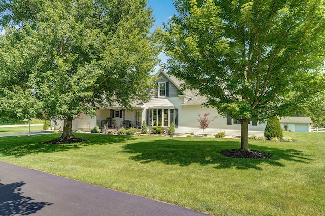 1568 Glossip Ave, Highlandville, MO 65669 - obstructed view of property featuring a front lawn and a porch