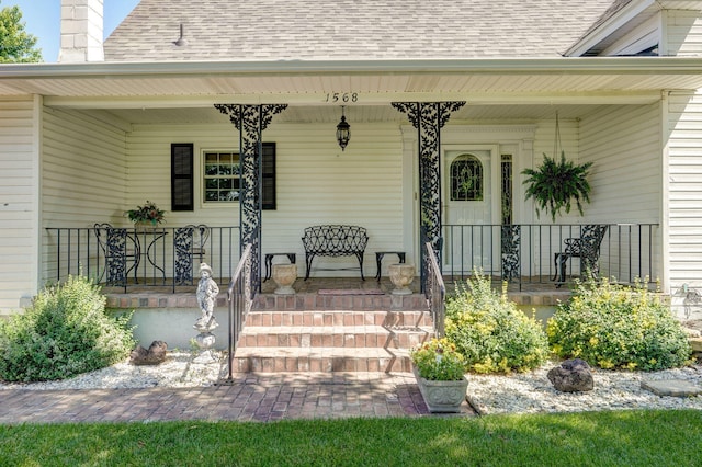 1568 Glossip Ave, Highlandville, MO 65669 - property entrance featuring a shingled roof, a porch, and a chimney