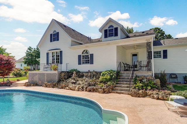 1568 Glossip Ave, Highlandville, MO 65669 - back of house with an outdoor pool, a porch, and roof with shingles
