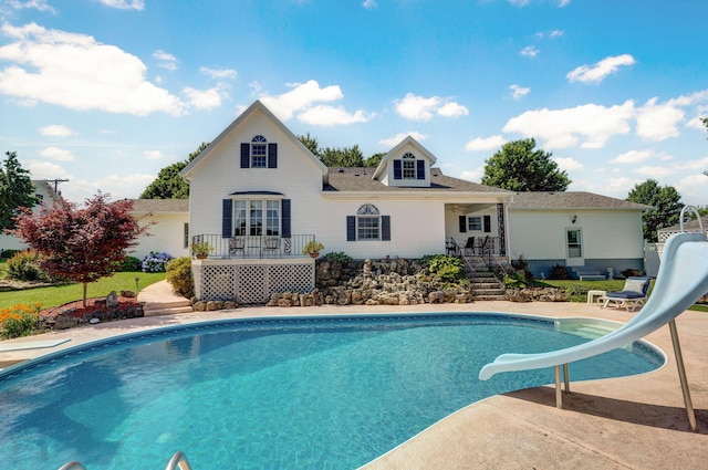 1568 Glossip Ave, Highlandville, MO 65669 - rear view of property with an outdoor pool and roof with shingles