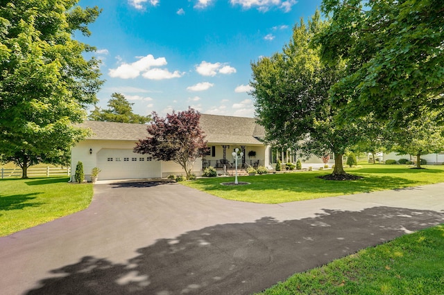 1568 Glossip Ave, Highlandville, MO 65669 - view of front of house featuring asphalt driveway, a garage, and roof with shingles